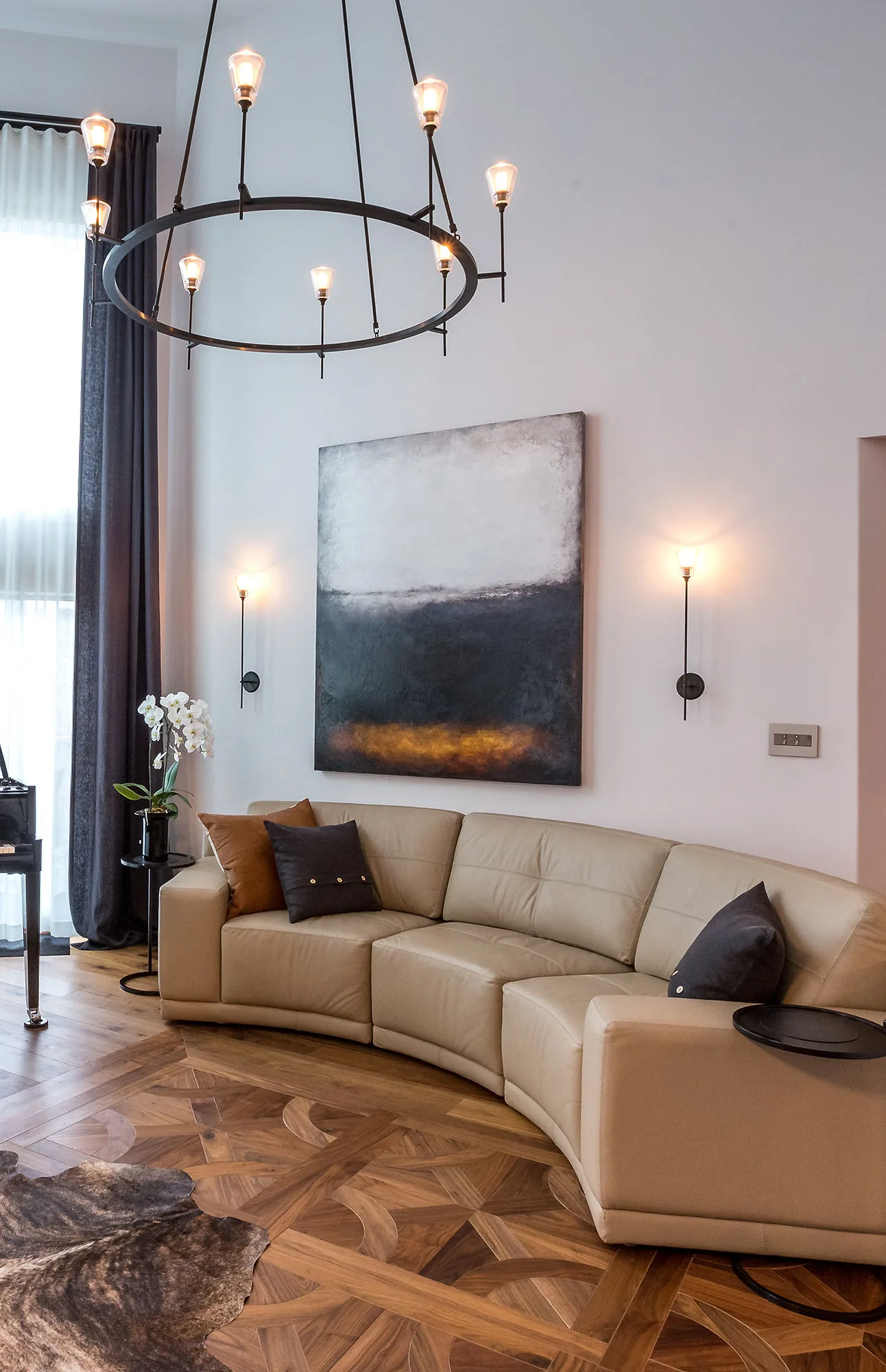 Alexander’s Residence — living room with piano and chandelier