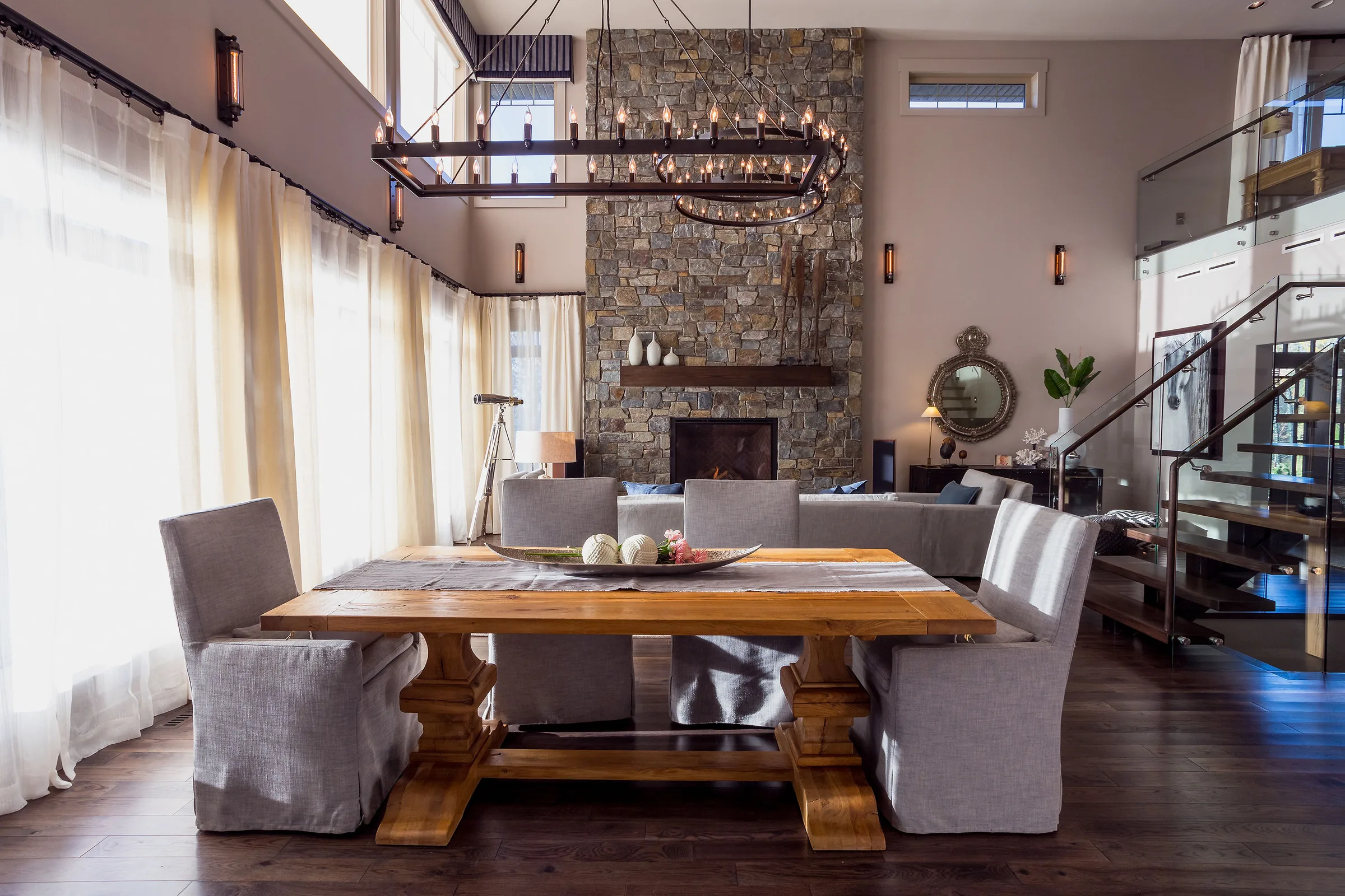 Lake House great room — double-height living and dining space by Shantam Interiors